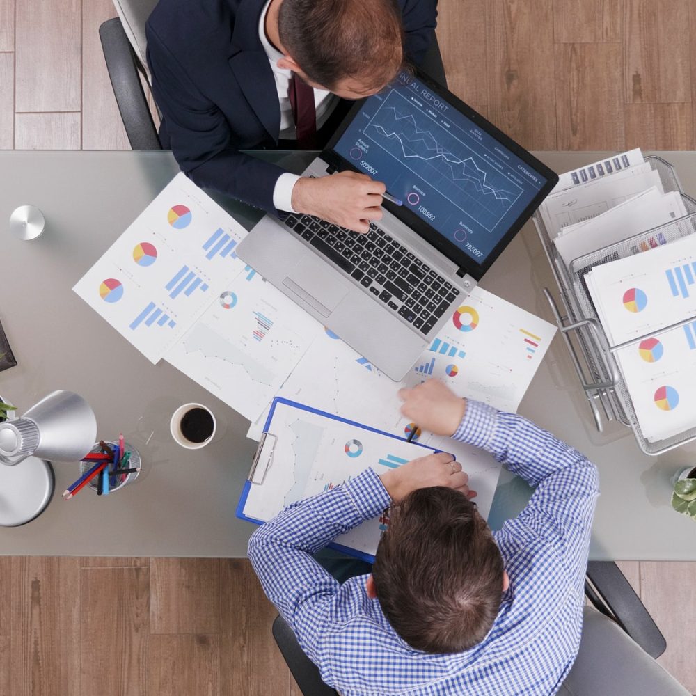 top-view-of-businessmen-analyzing-management-statistics-while-working-at-company-investments.jpg top-view-of-businessmen-analyzing-management-statistics-while-working-at-company-investments.jpg